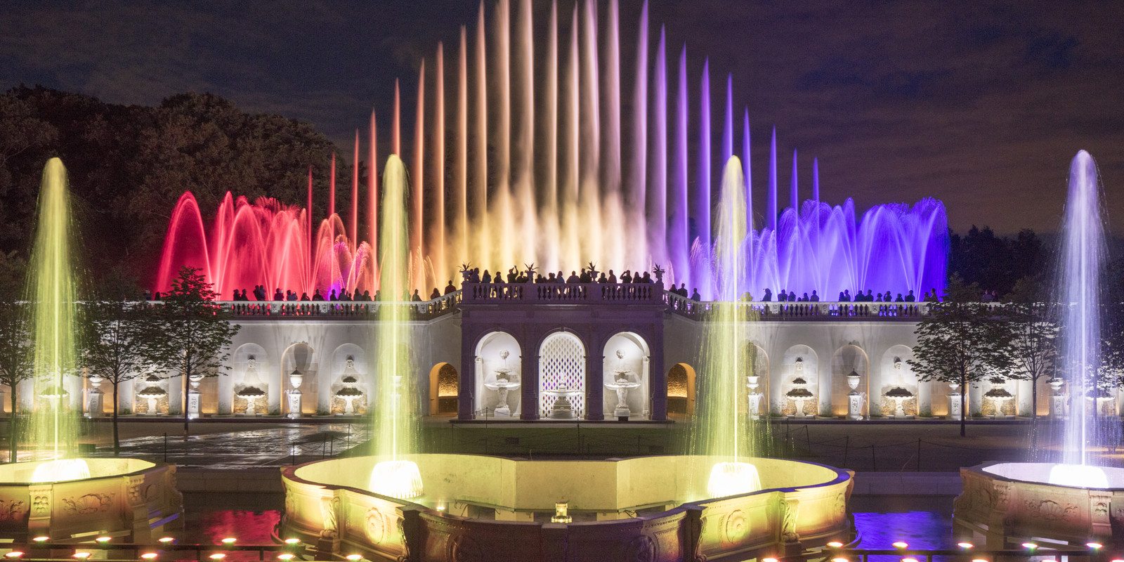 Fountain under lights during night time