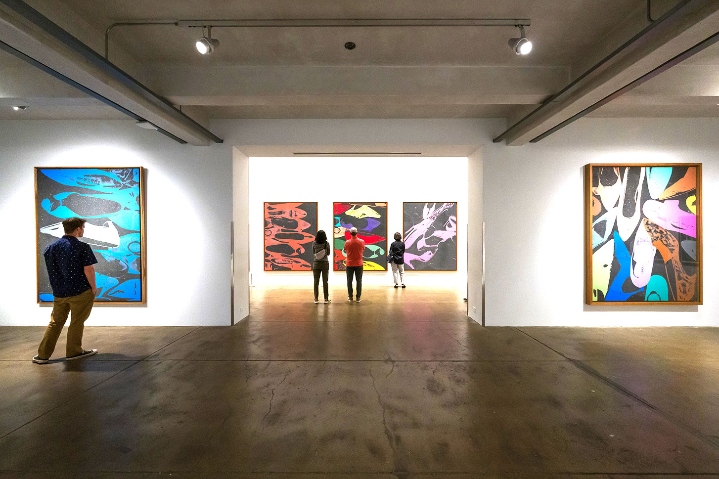 visitor viewing art work inside museum