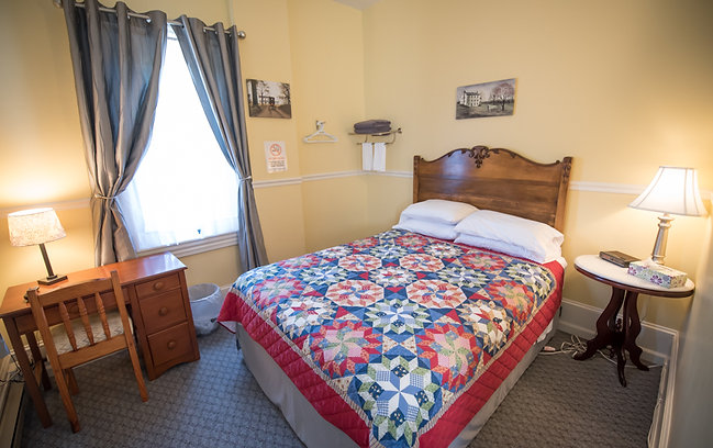 Bed and a desk in hotel room