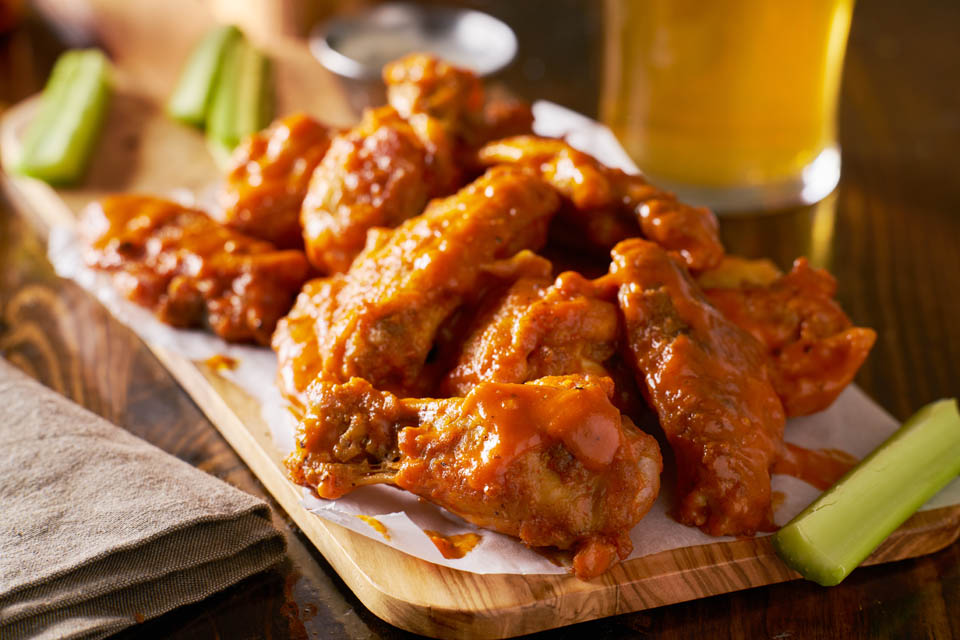 Buffalo Chicken wings with Celery on plate