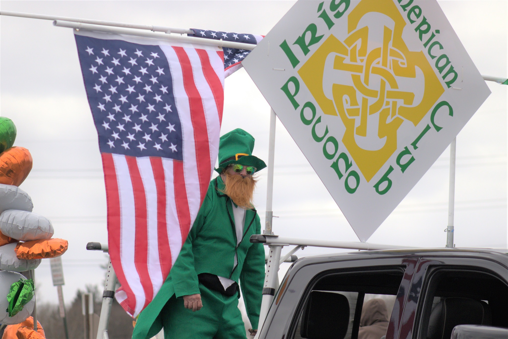 a person dressed in full green at Irish fest