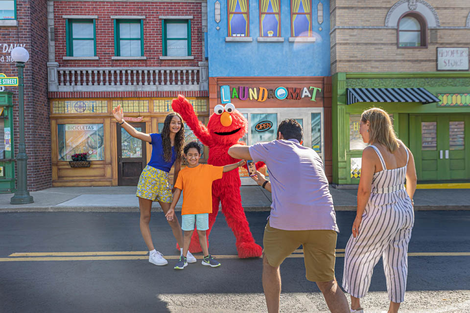 people taking photos at sesame place