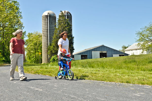 Kid Biking along with mom and granny