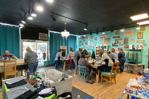 people inside chalk shop