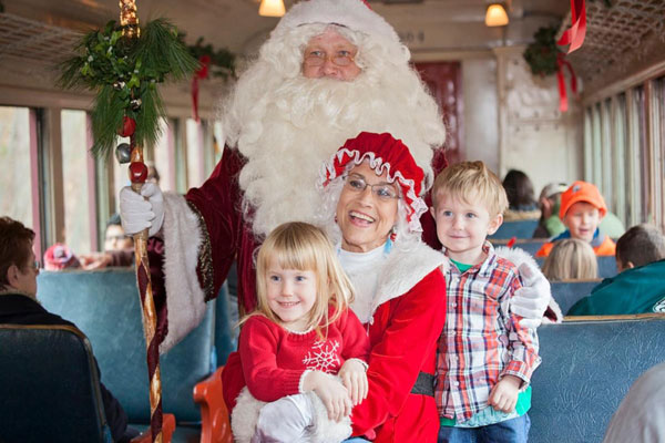 childrens taking pictures with Santa on Train ride