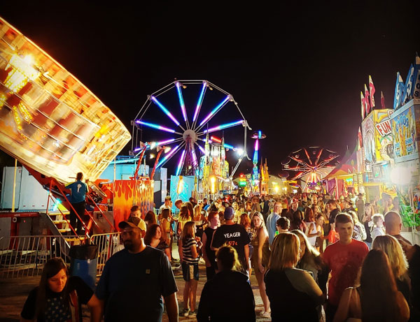 people walking around at county fair