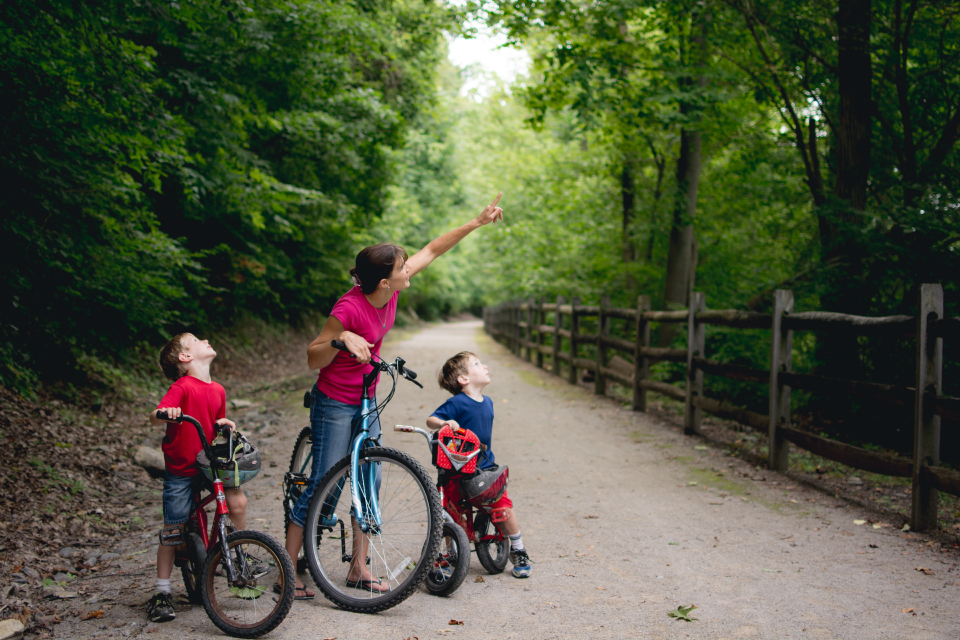 Mother biking with sons