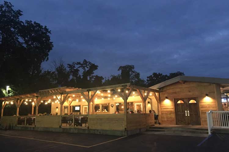 A restaurant with lights on at night