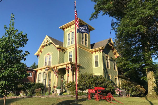 flag post in front of a house