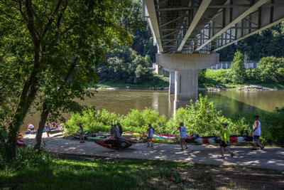 kayakers carrying kayaks oil creek