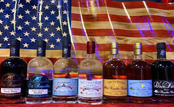 whiskey bottle collection of Old republic Distillery put in infront of American Flag