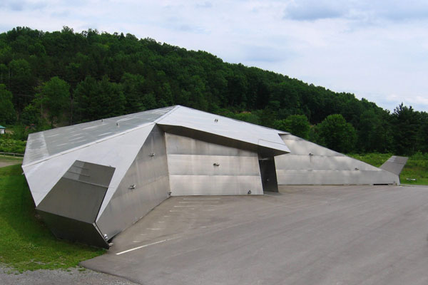 A steel structure with trees in the background