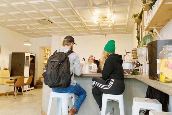 two people sitting on coffee bar