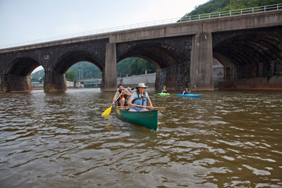 stone bridge behind kayaks on kiski conemaugh water trail