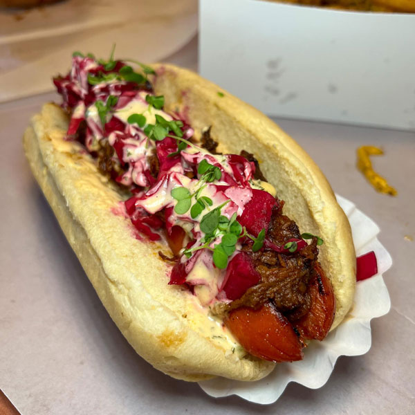 Hotdog loaded with beets