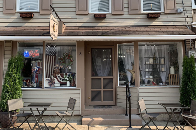 tables and chairs infront of store