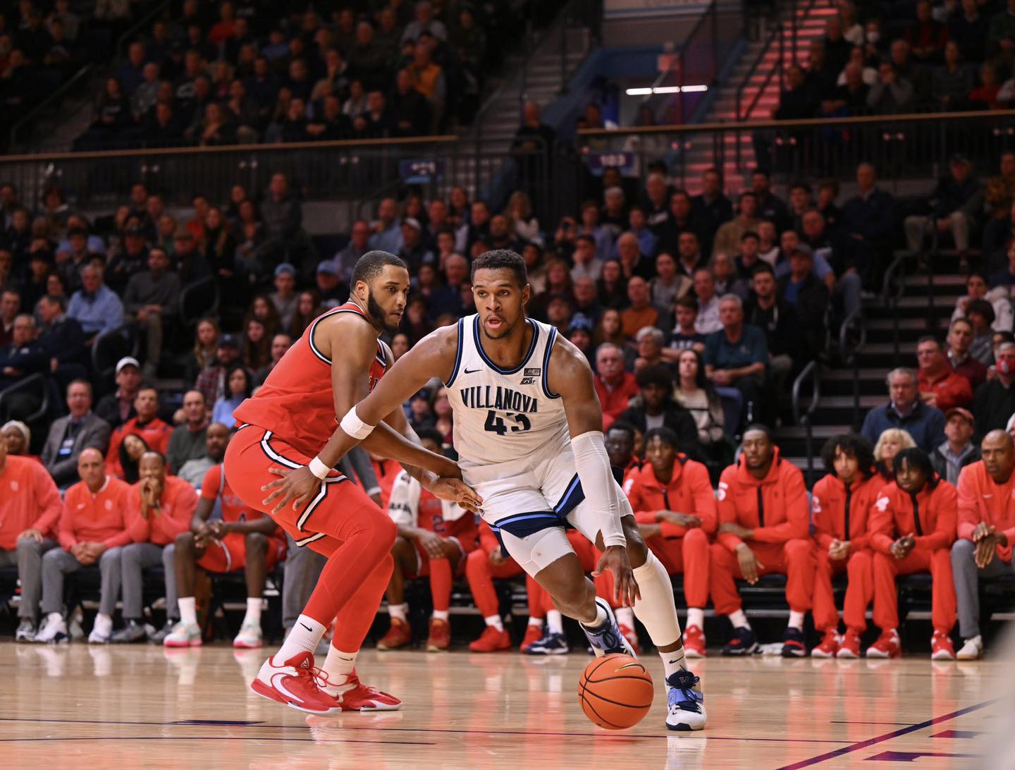 two athletes playing basketball