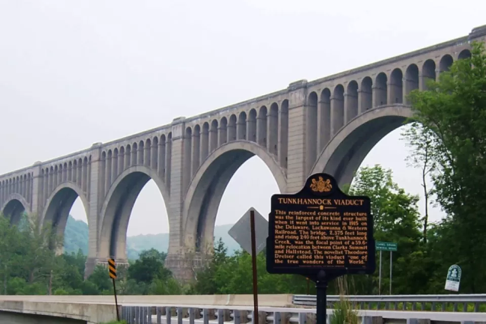 old highway bridge next to road