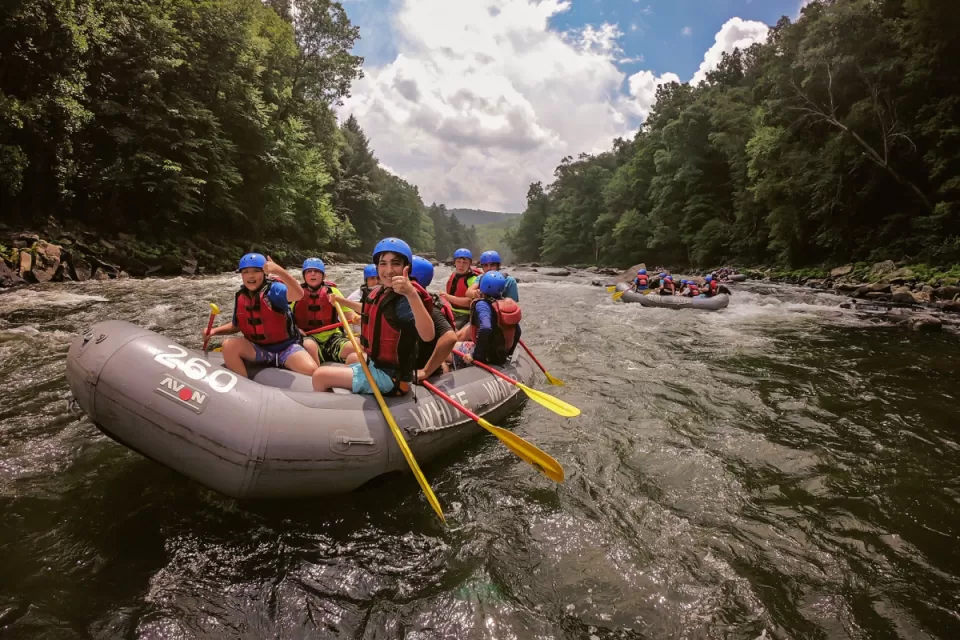 group of people enjoying adventure whitewater rafting on youghiogheny river