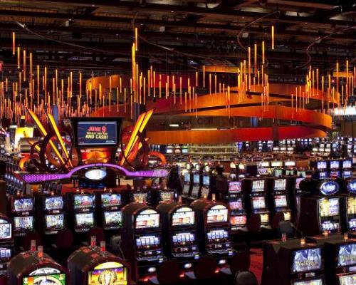 A photo of slot machines and colorful lighting on the casino floor at Wind River casino in Bethlehem, PA