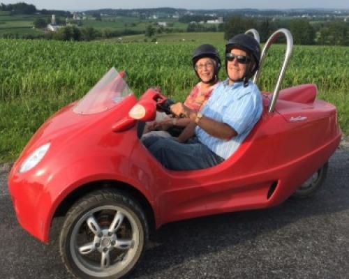 couple riding scooter