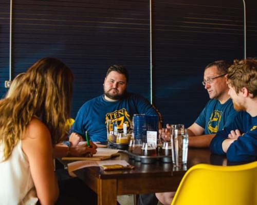 people hanging out inside brewerie