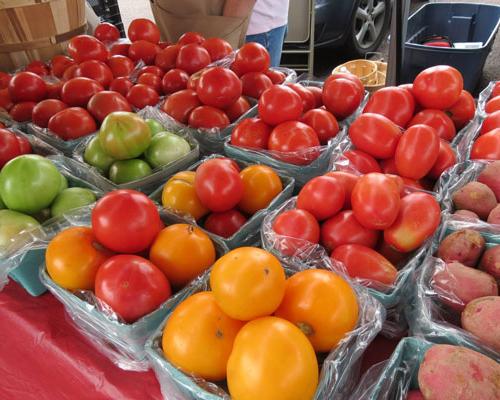 tomatoes and potatoes in boxes