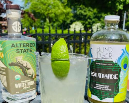 vodka bottles with drink in a glass lime topped