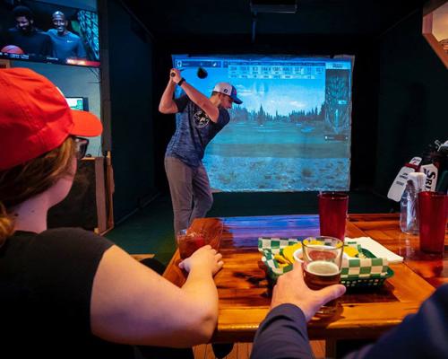 person playing golf indoor