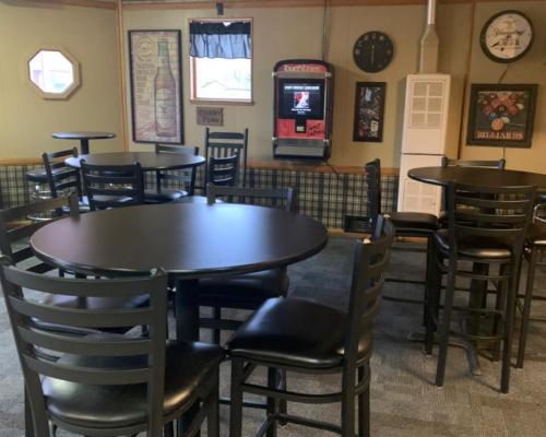 tables and chairs inside restaurant