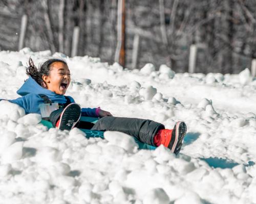 a girl snowtubing