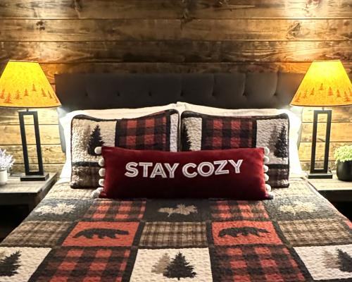 Bed with "Stay Cozy" Pillow